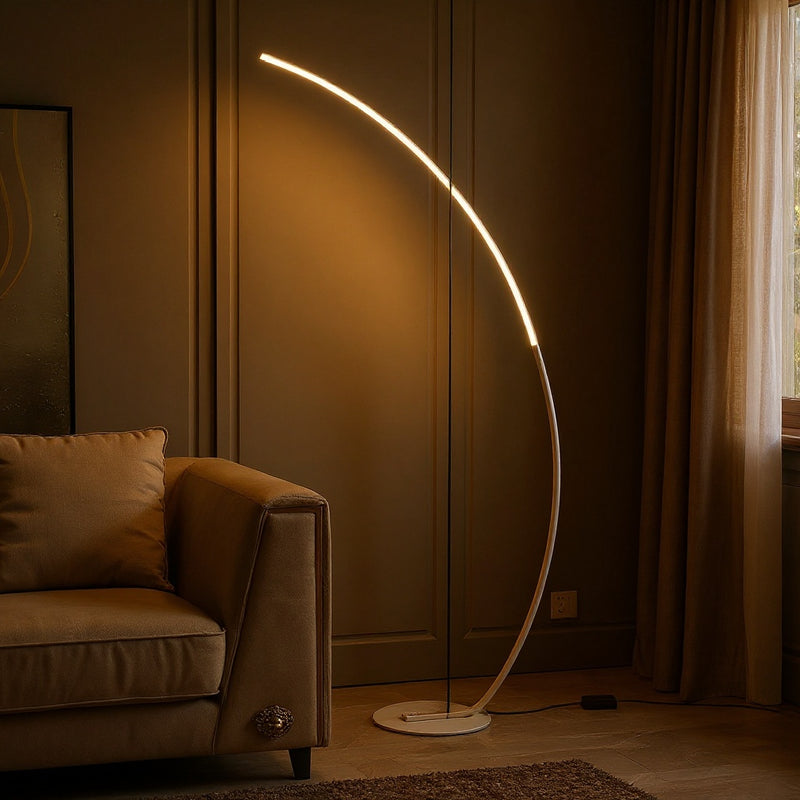 The Brass Arc Floor Lamp: A Study in Golden Light and Quiet Elegance
